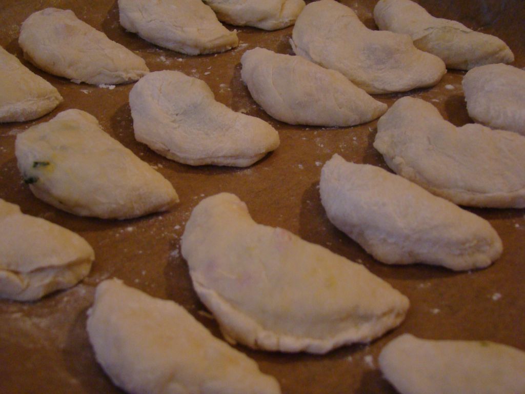 Pirozhki on a baking paper 