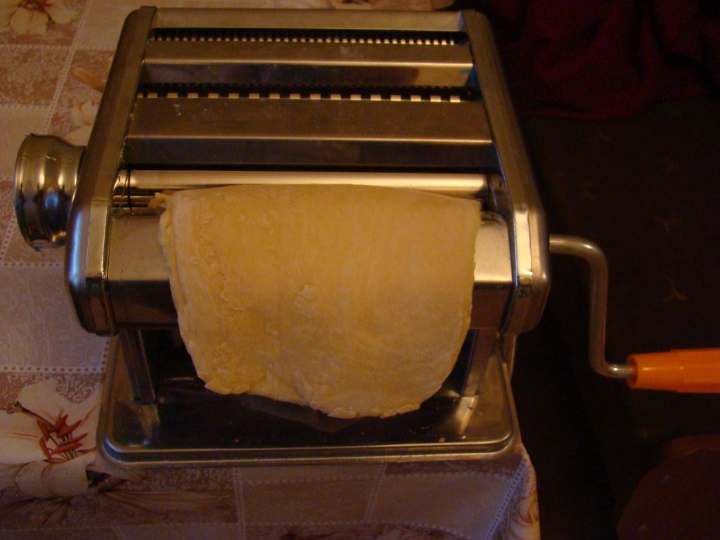 Roll out pasta dough using Macaroni machine