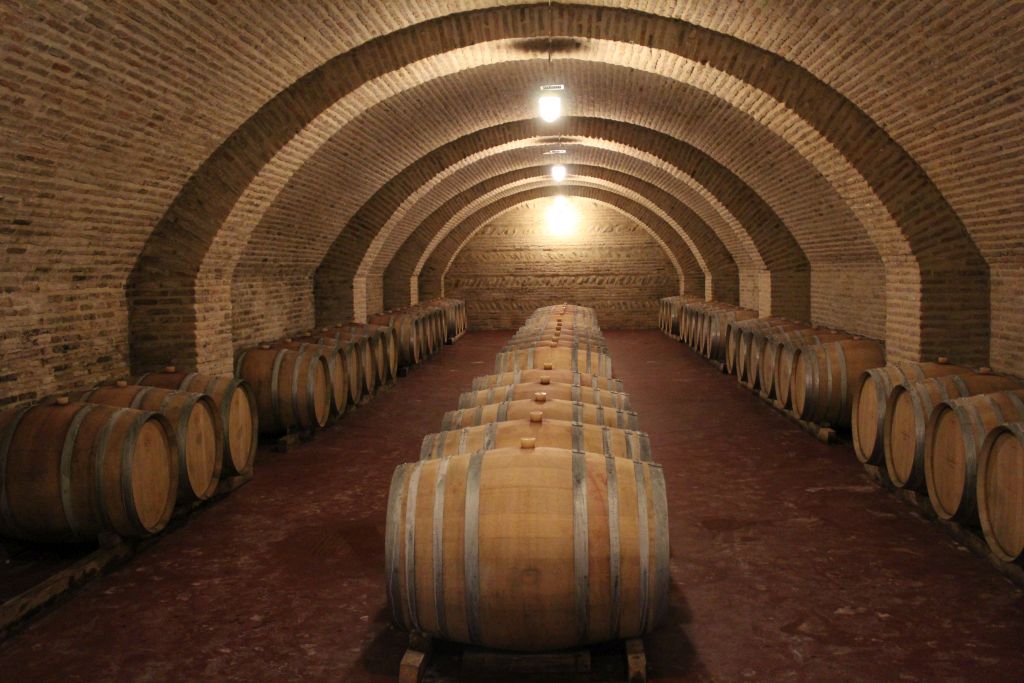 Wine cellars with oak barrels at Château Mukhrani
