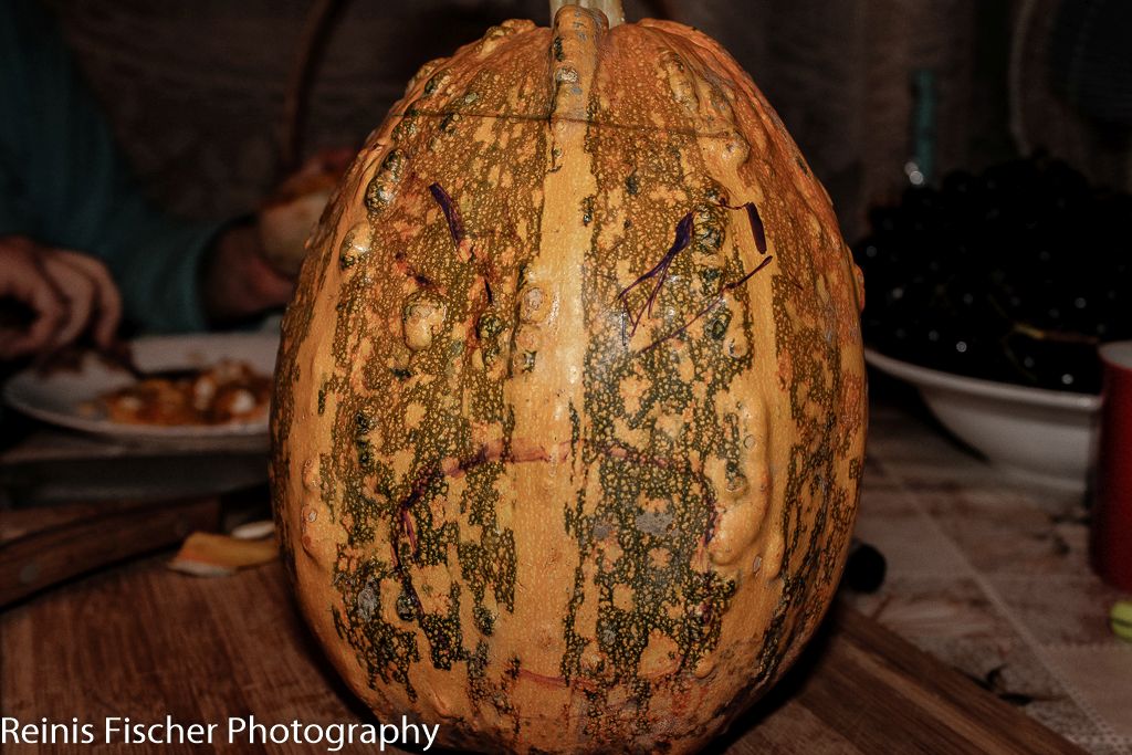 Using marker to draw up lines on a pumpkin