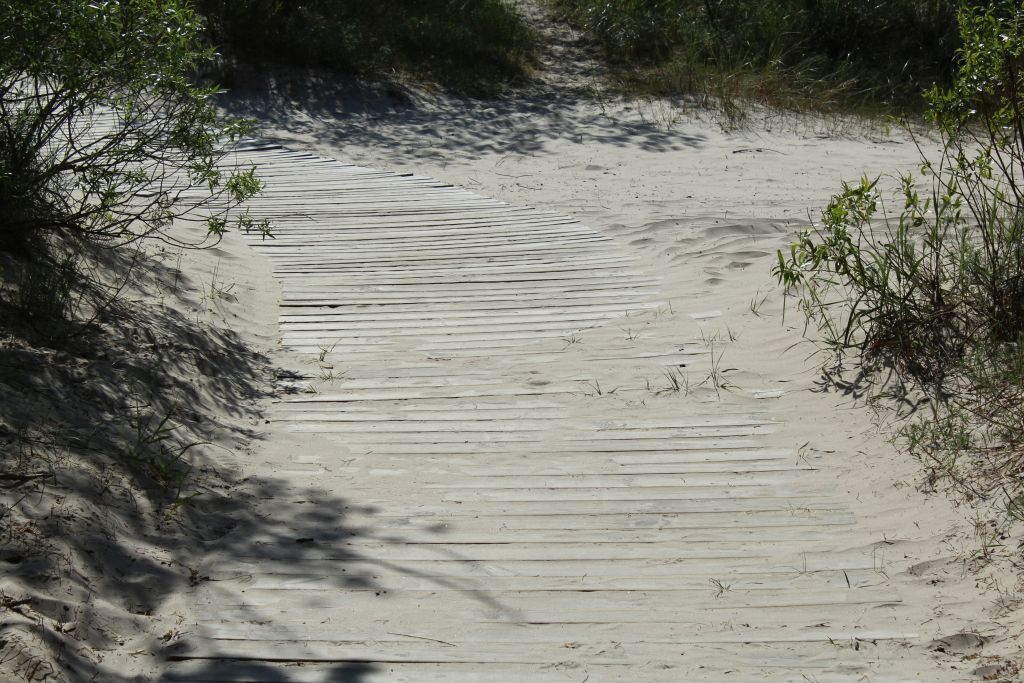 Wooden boardwalk heading to sea in Liepaja