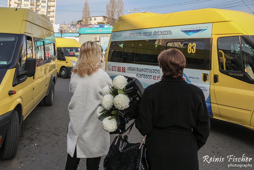 Women with flowers waiting for marshrutka