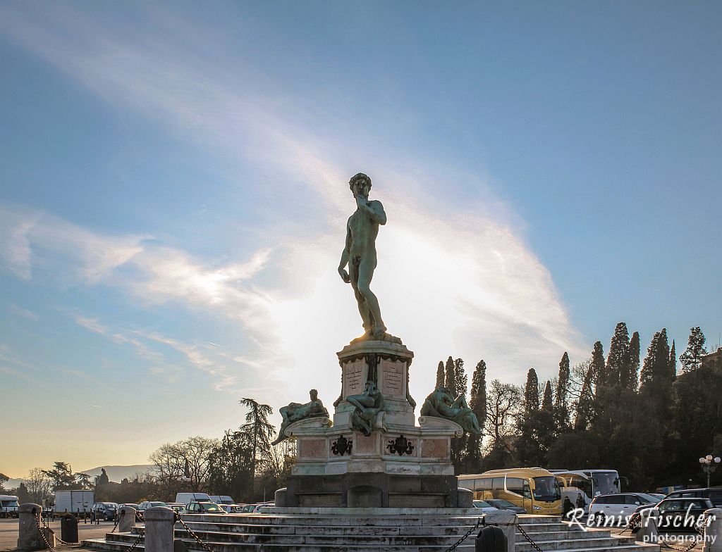 Bronze cast of David facing Florence from the center of the square