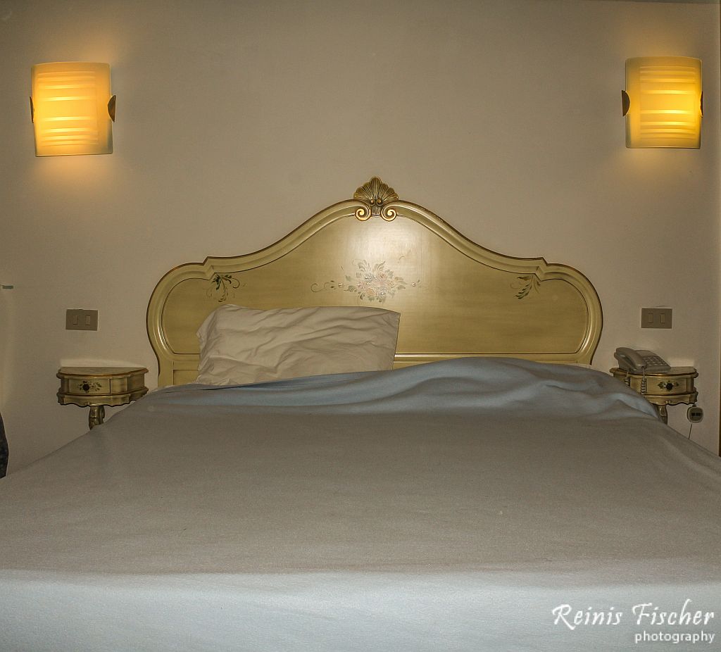 Queen size bed at Hotel Guerrini