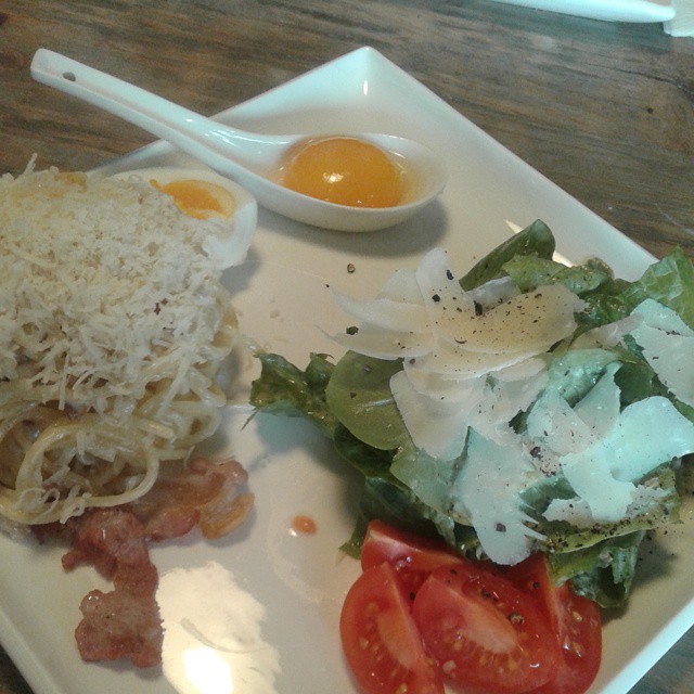 Italian lunch - salad Caesar with chicken and pasta carbonara