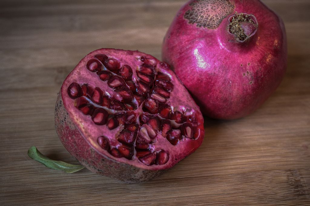 Take a pomegranate and divide it