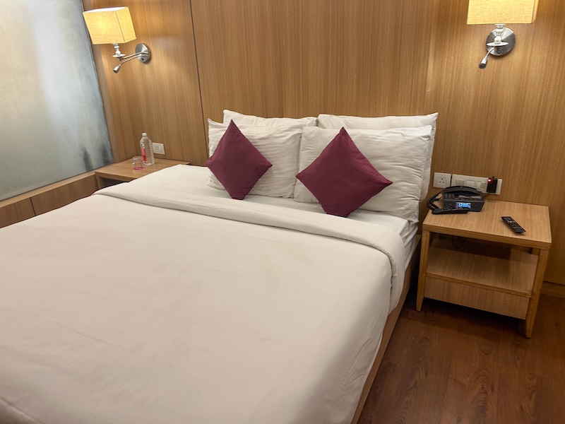Queen size bed at Royal Orchid Central hotel in Jaipur