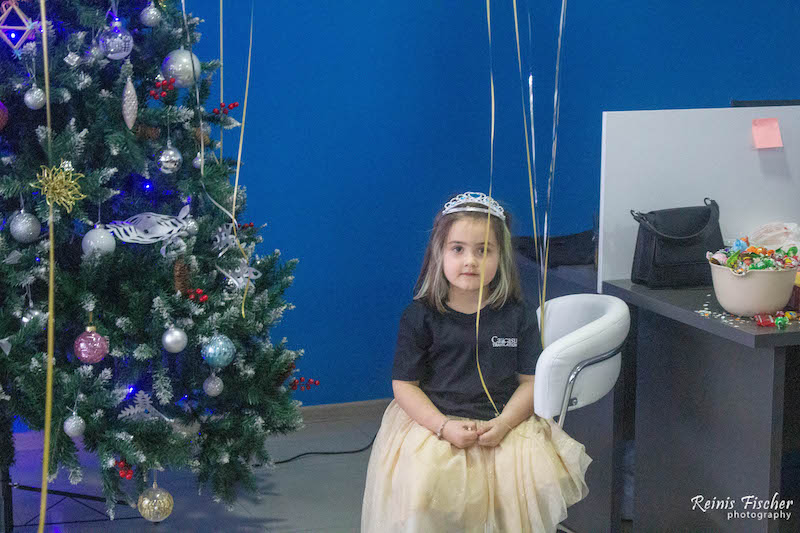 kiddo next to the Christmas tree